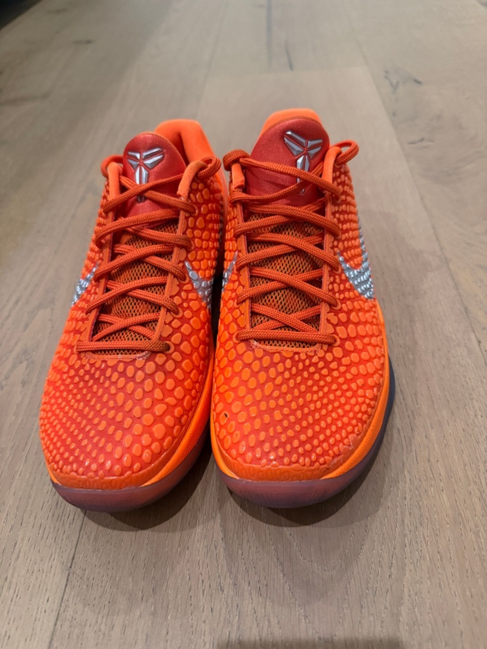 Kobe’s-  Nike Orange Low-Profile Basketball Sneakers with Metallic Swoosh